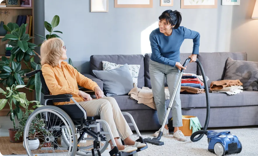 A woman takes care of an old woman